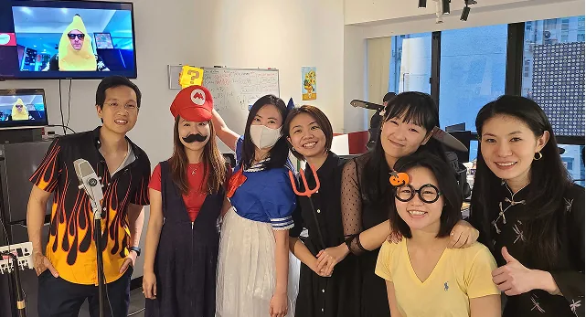 MeeOpp teammates in costumes gathered in the office