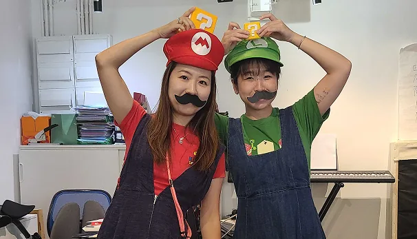 Two MeeOpp teammates dressed up as Mario and Luigi for a costume day at the office