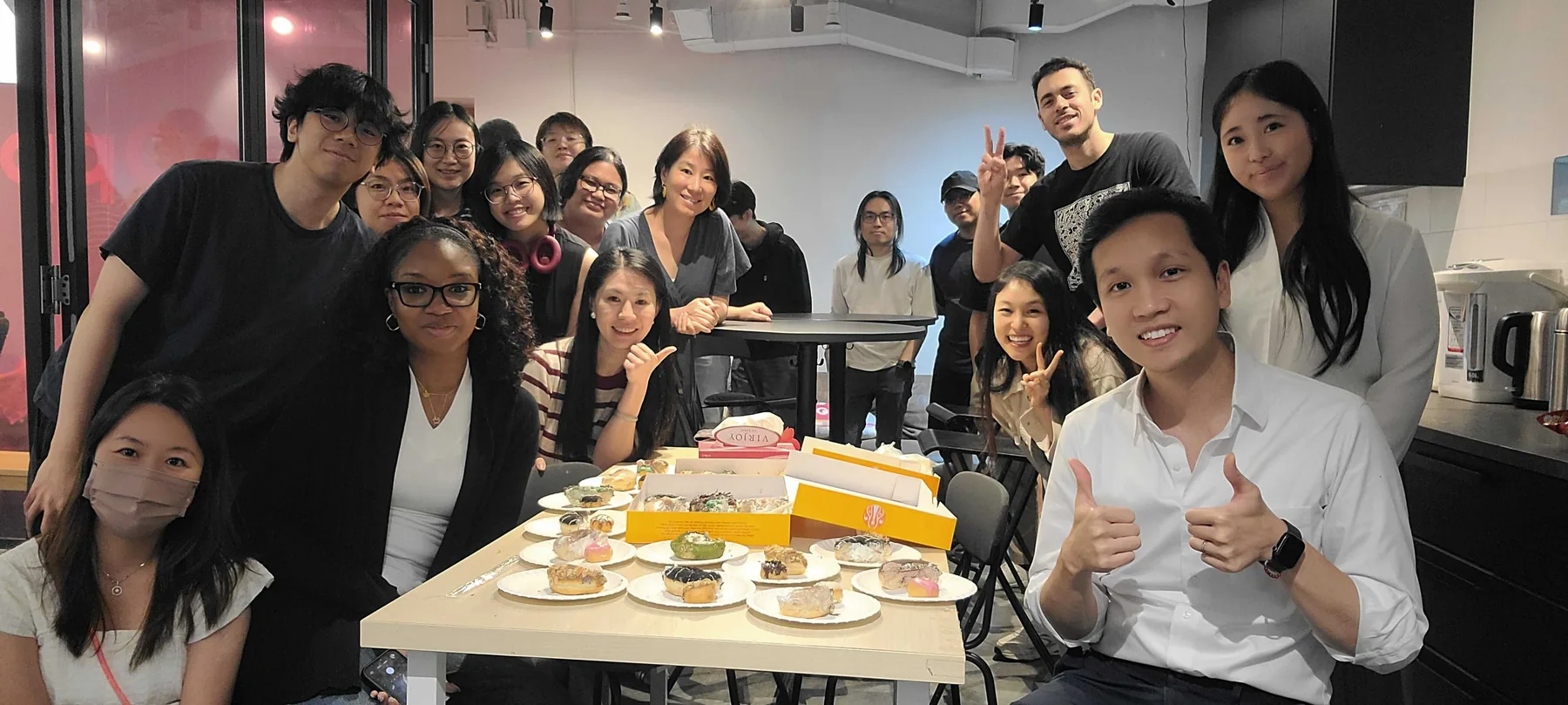 The MeeOpp team gathered around the office table for treats